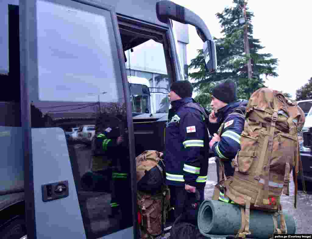 Georgian firefighters board a bus bound for Turkey at an unspecified location in Georgia on February 6. Tbilisi has sent 60 search-and-rescue specialists, along with relevant equipment, to neighboring Turkey to assist with the massive rescue operation currently under way.&nbsp;