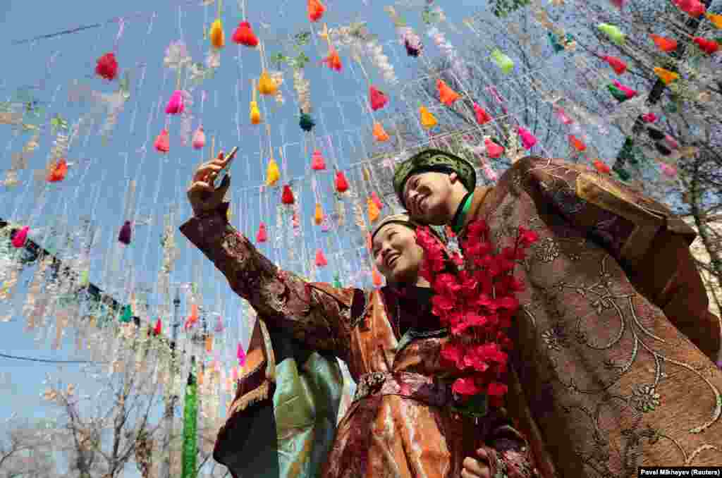 Participants take a selfie in Almaty, Kazakhstan, on March 21. Celebrated on the spring equinox, Norouz is a&nbsp;celebration of love, fertility, and spiritual renewal that spreads the message of hope far and wide and lasts for 13 days.