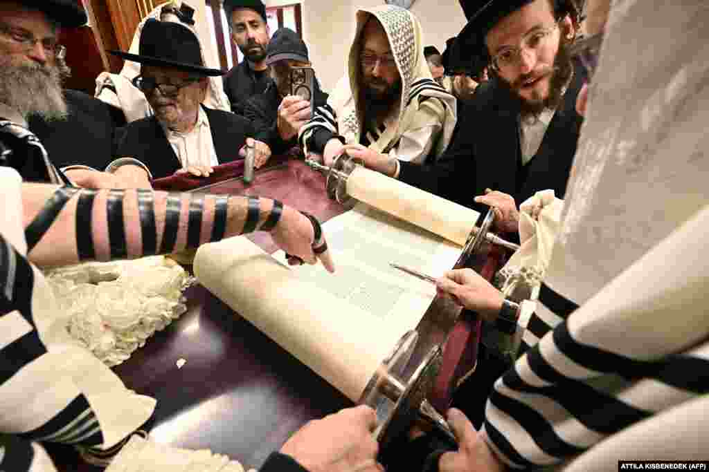 Hasidic Jewish pilgrims pray with the Torah at the home of&nbsp;Rabbi Yeshaya Steiner.