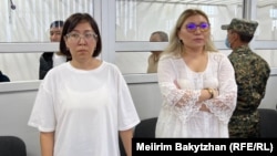 Journalist and activist Aigerim Tleuzhan (left) and her lawyer, Ainara Aidarkhanova, in court on July 11.