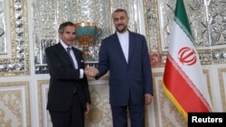 IAEA chief Rafael Grossi (left) meets with Iran's Foreign Minister Hossein Amir-Abdollahian in Tehran on March 4.