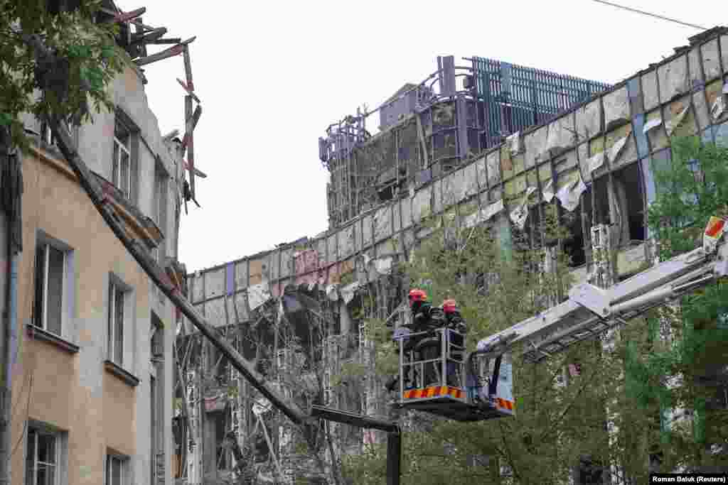 Rescuers work at a residential building hit by a Russian missile strike in Lviv, in western Ukraine, on July 6. Ukrainian officials said at least 10 people were killed in the early morning attack.