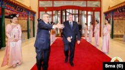 Bosnian Serb Prime Minister Radovan Viskovic (center) visits Beijing on April 5.