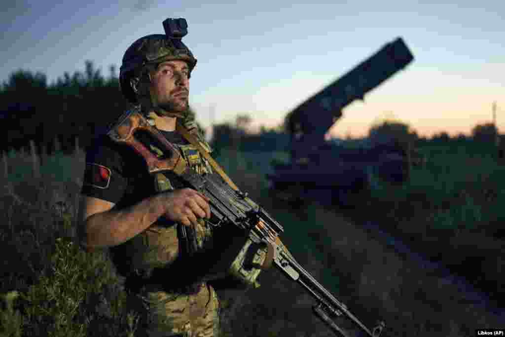 A Ukrainian soldier keeps watch near the captured hardware. &quot;Our troops conduct aerial reconnaissance and demining of the area, employing artillery fire on identified enemy targets,&quot; Malyar said on Telegram. &nbsp;