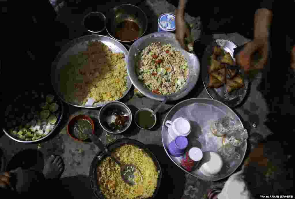Iftar meals are set out inside a shelter at a camp for internally displaced people in Sanaa, Yemen. &nbsp;