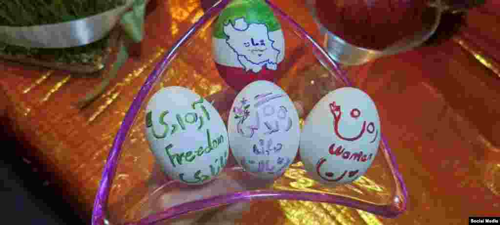 A selection of this year&#39;s Norouz&nbsp;eggs (Haftseen) feature the anti-government slogan &quot;Woman, life, freedom&quot; in Iran. Iran has been rocked by mass protests for the past six months following the death of a young woman in police custody.&nbsp; Though Norouz is associated with being Persian and Iranian, the holiday is celebrated throughout Western Asia, Central Asia, the Caucasus, the Black Sea Basin, the Balkans, and South Asia.