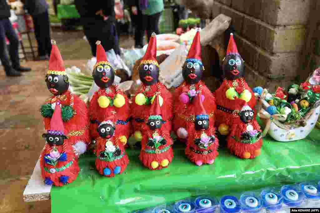Figures of the fictional folklore character Hajji Firuz, who appears in the streets at the beginning of Norouz, are displayed at a stall in Tehran ahead of the festival.&nbsp;&nbsp; &nbsp;
