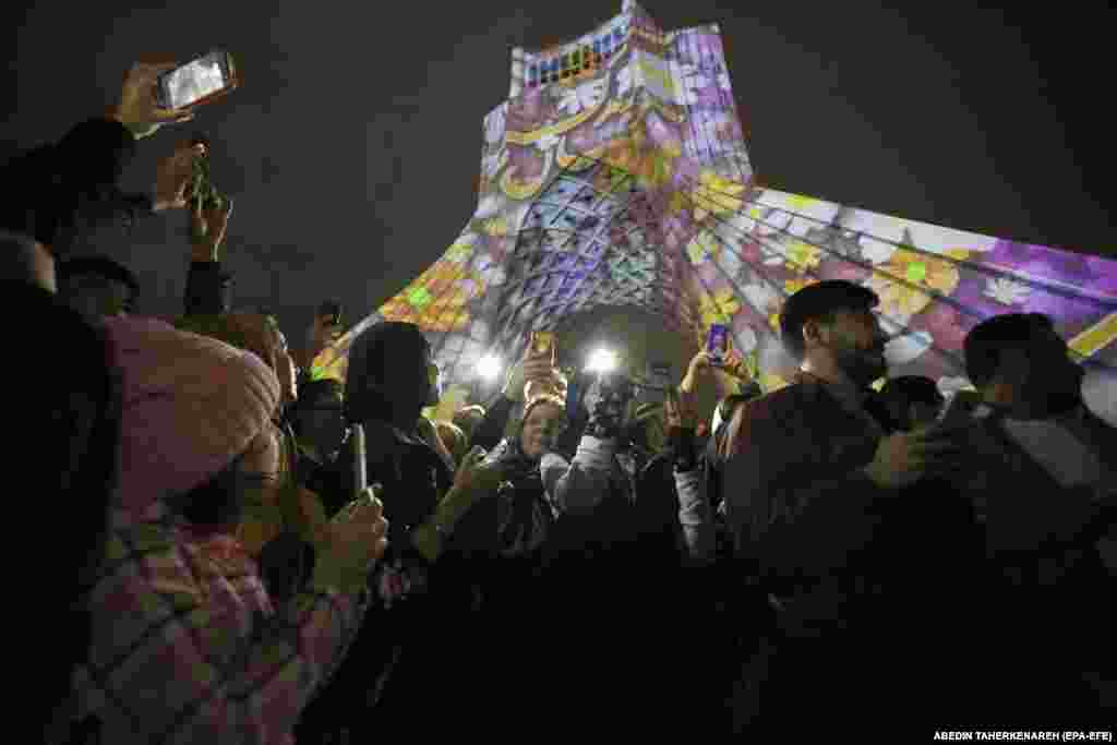Iranians take pictures as they celebrate near the Azadi Tower in Tehran. The Persian New Year, which has been celebrated for at least 3,000 years, is one of the most important celebrations in the greater Persian world.