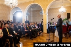 Wu (left) listens to a speech by Czech President Petr Pavel at the European Values Summit 2023 in Prague.