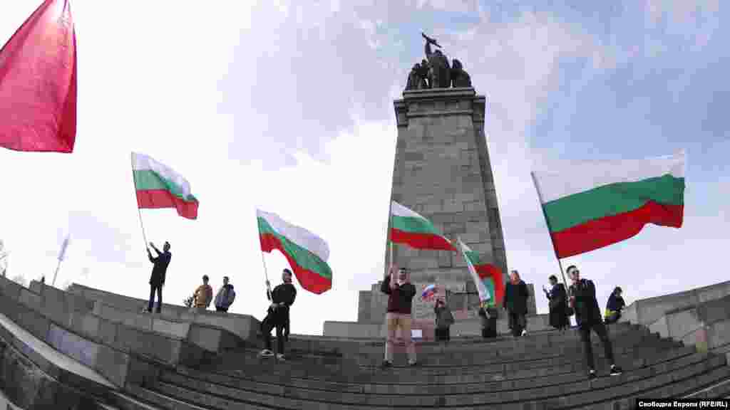Protesters wave Bulgarian flags during the protest. The Soviet memorial is the property of Bulgaria&rsquo;s central government, meaning Sofia&rsquo;s mayor still needs to make a request to the regional governor to remove the contentious landmark.