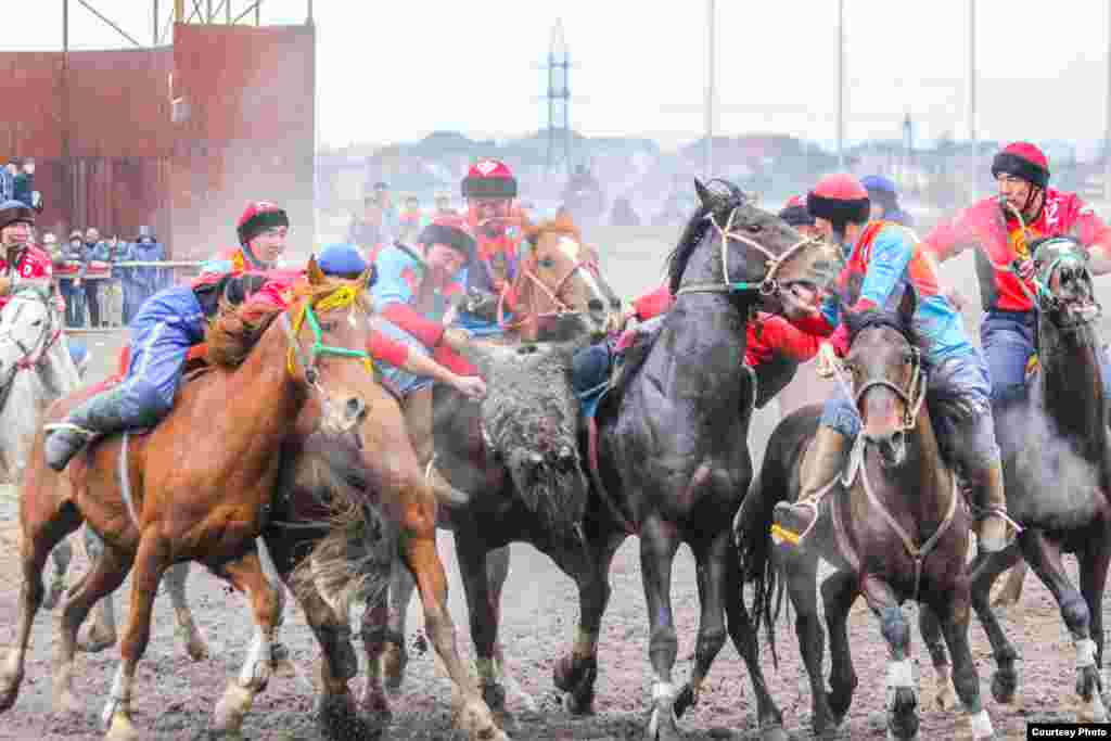 Horsemen show off their riding skills during a kok-boru tournament in Bishkek.