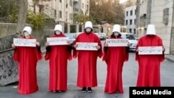 A group of women in Iran protest against the lack of women's rights by referencing Margaret Atwood's story The Handmaid's Tale, in December 2022.