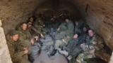 A group of Russian soldiers who refused to take part in hostilities are pictured in a cellar in Ukraine's Donetsk region in December 2022.