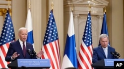 U.S. President Joe Biden (left) and his Finnish counterpart, Sauli Niinisto, speak to reporters in Helsinki on July 13. 