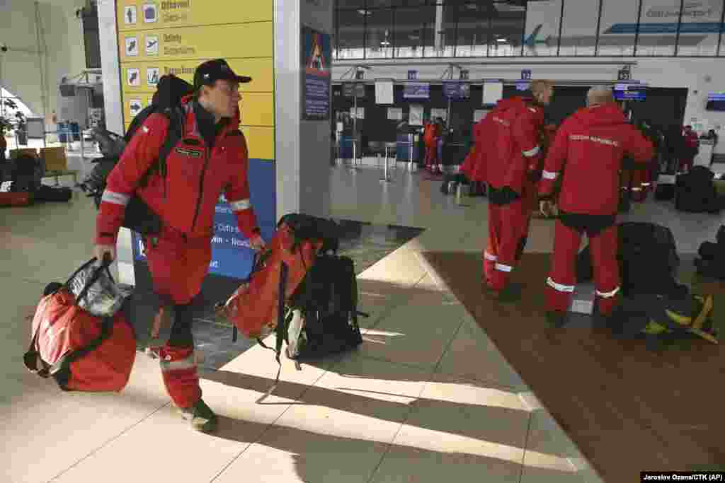 Members of the Czech Republic&#39;s 68-member urban search-and-rescue team prepare to fly out of Ostrava airport on February 6.&nbsp;