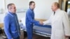 Soldiers wounded in the Ukraine invasion shake hands with Russian President Vladimir Putin during his visit in May to the Mandryk Central Military Clinical Hospital.