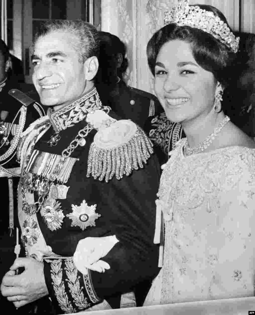 The shah of Iran, Mohammad Reza Pahlavi, and his wife, Farah (née Diba), are photographed during their wedding ceremony in Tehran on December 21, 1959.&nbsp;