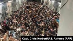 A U.S. Air Force aircraft evacuates some 640 Afghans from Kabul to Qatar on August 15, 2021.