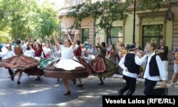 Ethnic Hungarians in Vojvodina, north Serbia, dance at a street festival. Hungary's National Election Office estimates that 68,492 voters with an address in Serbia are registered for the elections.