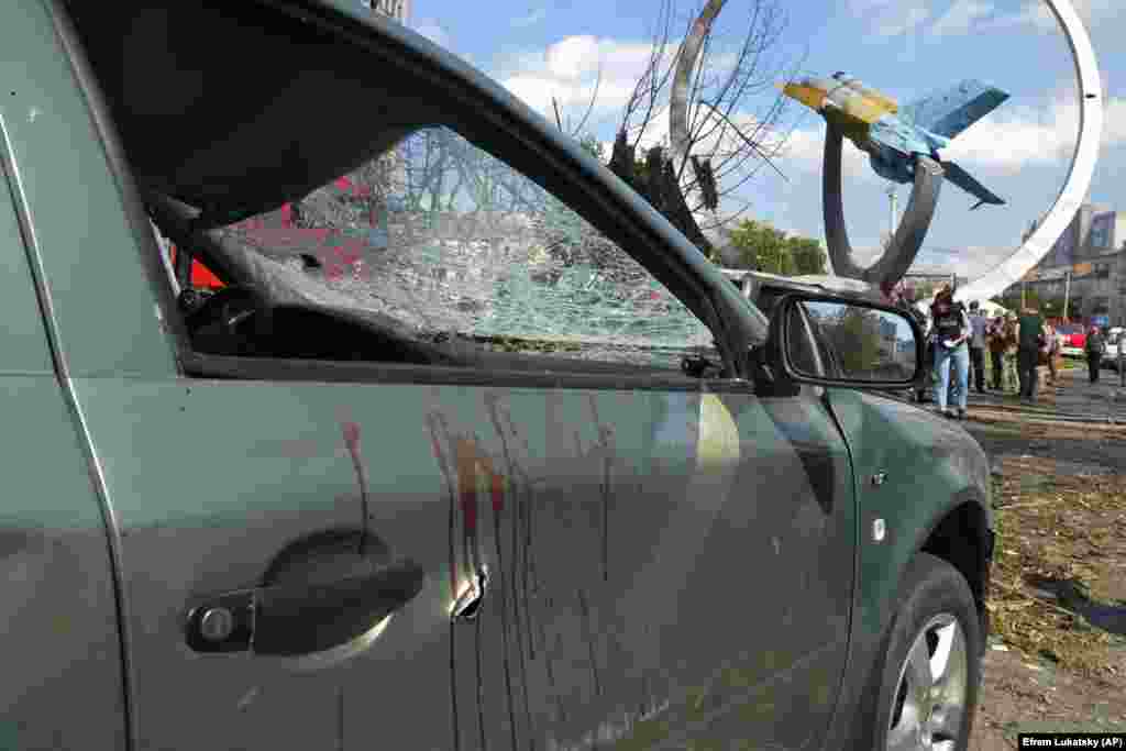Blood stains are seen on a damaged car. Ukrainian President Volodymyr Zelenskiy condemned the attack as &ldquo;an open act of terrorism.&quot;