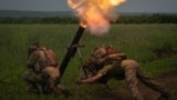 Ukrainian soldiers fire toward Russian positions on the front line in the Zaporizhzhya region on June 24.