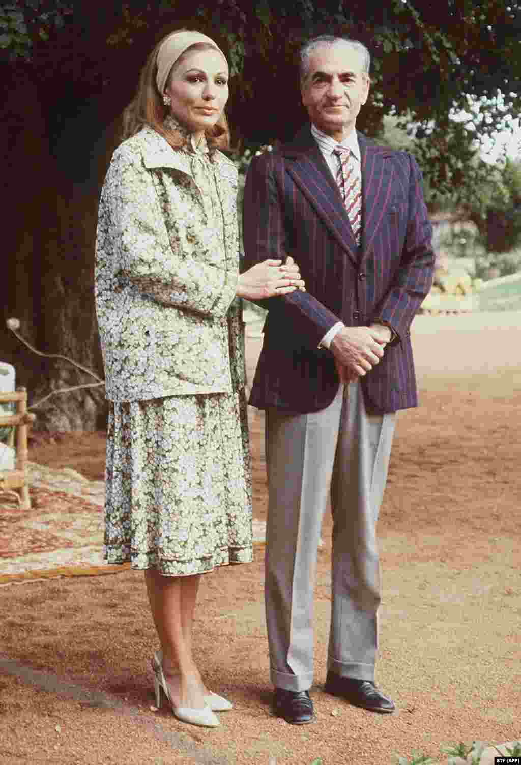 The deposed shah and Farah pose for a photographer in Marrakesh, Morocco, a few days after fleeing Iran in January 1979.