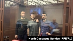 Abubakar Rizvanov (left to right), Kemal Tambiyev, and Abdulmumin Gadzhiyev appear in the courtroom
in August 2021.