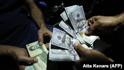 The U.S. dollar has reportedly been fetching up to 601,500 rials on Iran's unofficial currency-exchange market. (file photo)