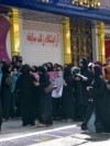 Afghan women stage a protest for their rights at a beauty salon in the Shahr-e Naw area of Kabul on July 19.