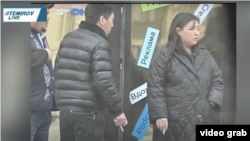 The propaganda video shows a surreptitiously taken photo of Temirov LIVE staff, including Temirov’s wife, who works for the outlet, smoking outside their office.